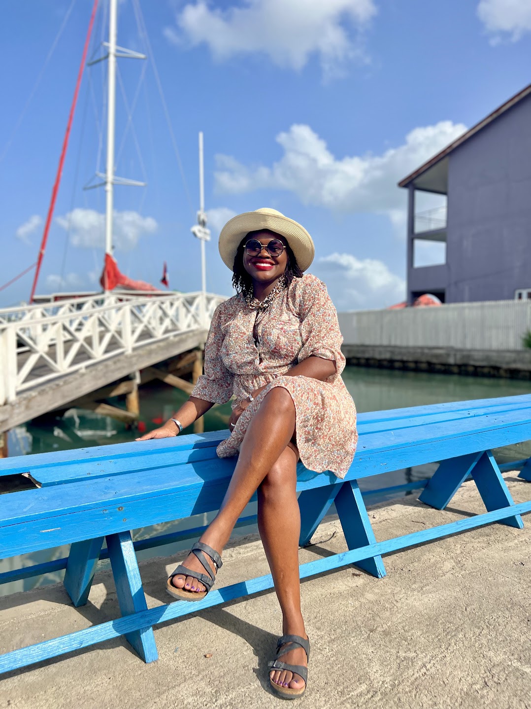 The founder of Caribbean Trend Lab, a native of Antigua and Barbuda, seated by the pier at Redcliffe Quay